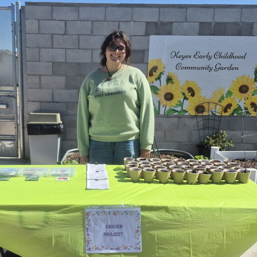 ESRCD staff smiling behind table